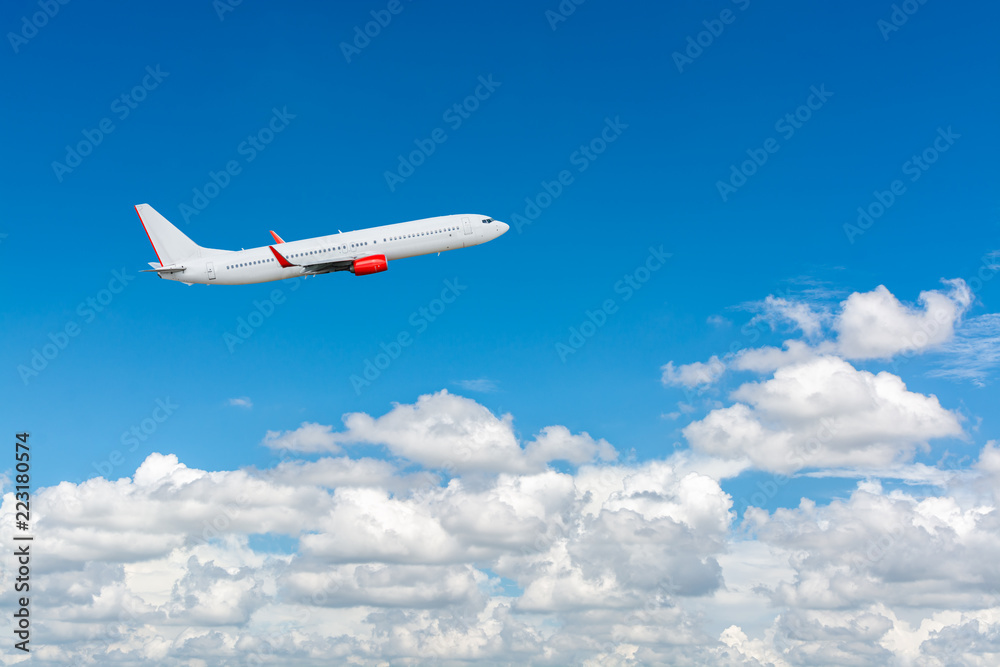 Airplane flying in the blue sky with cloud as the scene