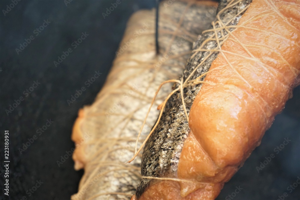 salmon fillets during traditional smoking, closeup