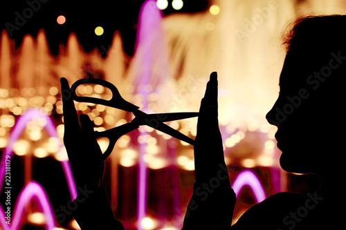 Silhouette of girl with scissors in hand. Education for art handmade.