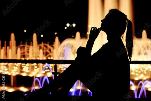 Fine girl on the street thinking, mind, sad, dream. Full length sitting, portrait.