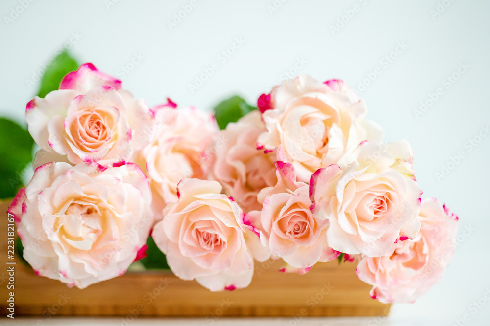 pink roses on a wooden tray pink roses on a wooden tray