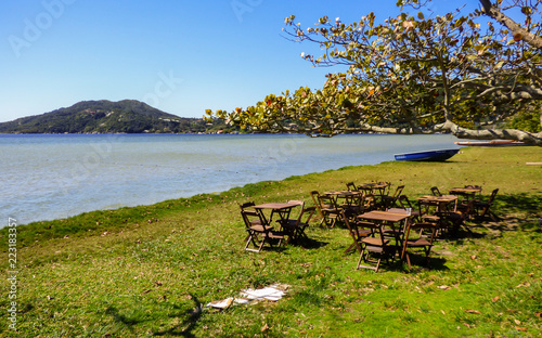 Florianopolis, Brazil - Circa August 2018: Restaurant tables at Lagoa da Conceicao, popular tourist destination in Florianopolis photo