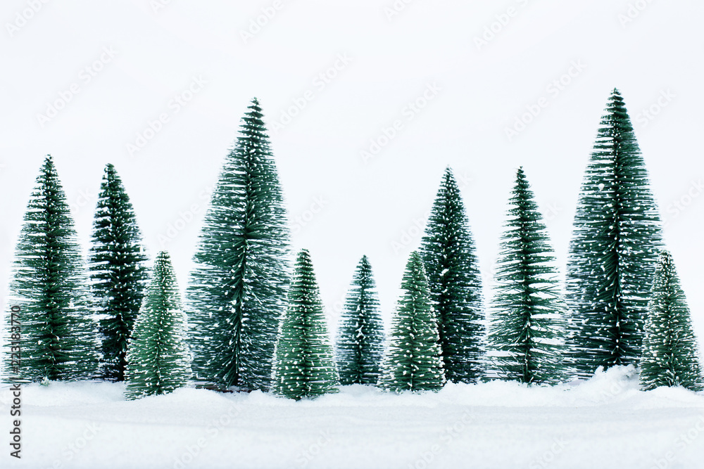 Christmas trees on the snow in winter. Christmas holiday celebration and new year concept. copy space