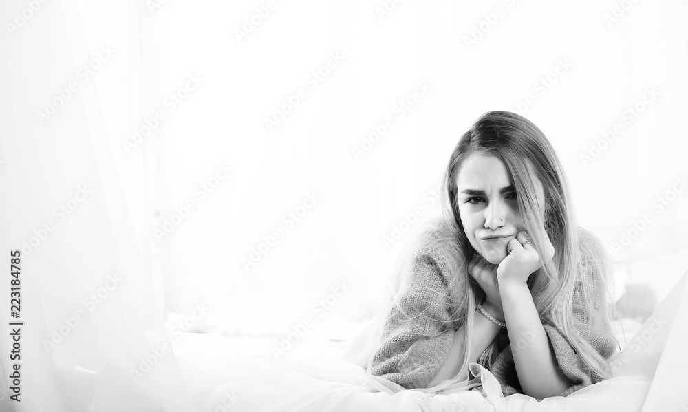 Young girl in a sweater in a room Young girl in a sweater in a room