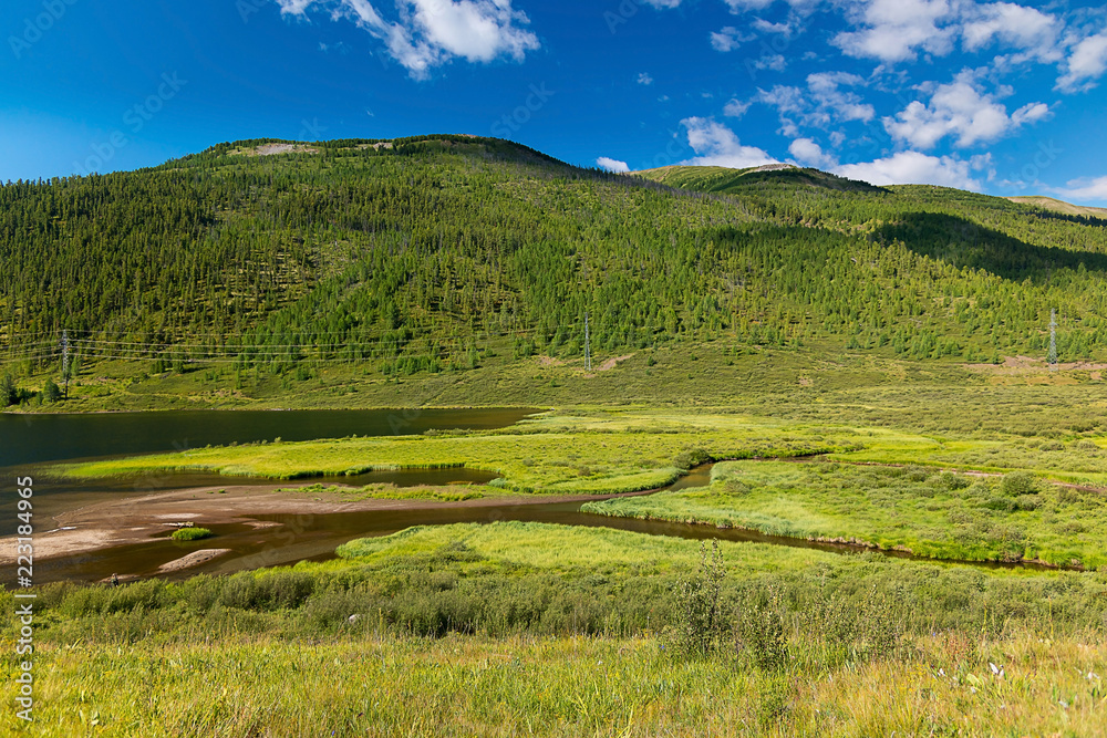 The valley of Lake Cheybekkol, against the backdrop of the mountains, Altai Republic, Russia The valley of Lake Cheybekkol, against the backdrop of the mountains, Altai Republic, Russia