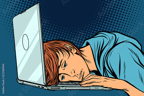 tired man at the computer