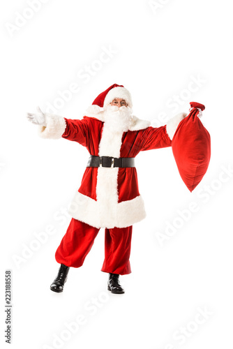 santa claus with outstretched arms holding sack isolated on white