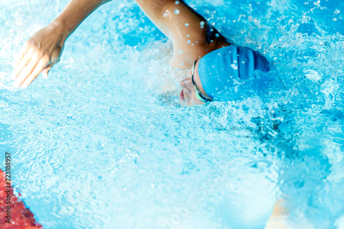 Image of sportsman swimming in style of crawl in swimming pool