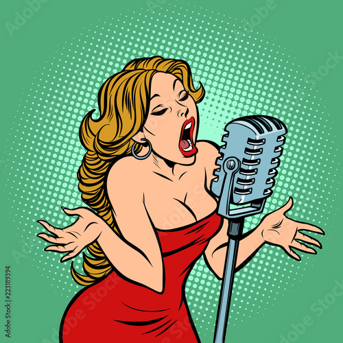 woman singer at the microphone. Music concert scene
