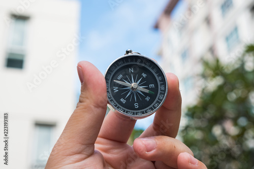 Hand with compass.