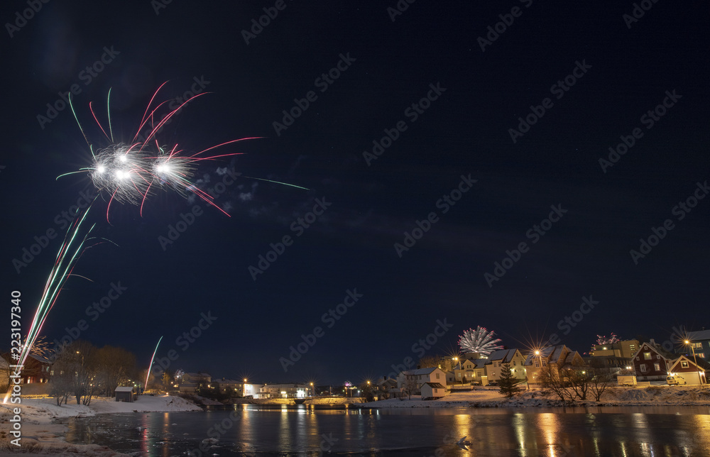 Celebration of New Year's Eve with fireworks in Bronnoysund Northern Norway
