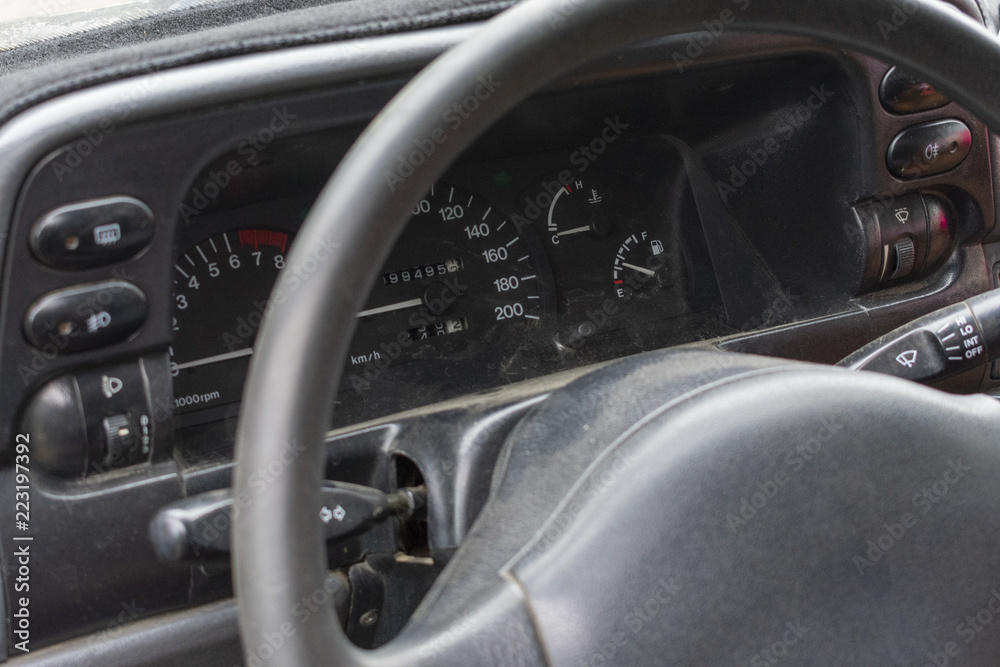 dashboard with indicators of speed, mileage and steering wheel in the car