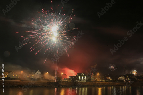 Celebration of New Year's Eve with fireworks in Bronnoysund Northern Norway