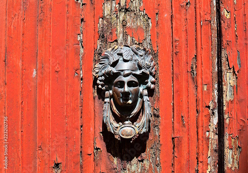 The old knocker at the red door