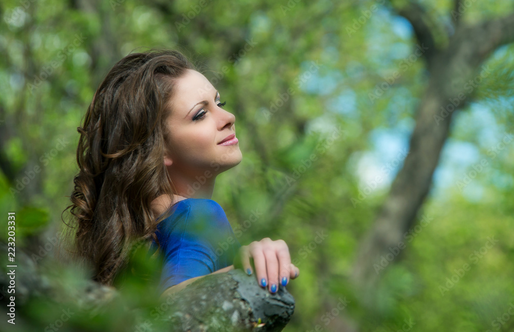 Beautiful young girl walking in spring Park Beautiful young girl walking in spring Park
