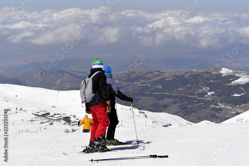 On the snow-capped peaks of the mountain Sierra Nevada skiers and snowboarders