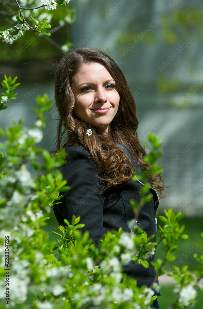 Beautiful young girl walking in spring Park Beautiful young girl walking in spring Park