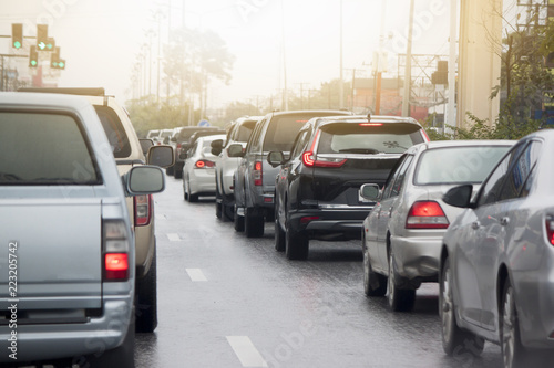 cars break on the road in traffic junction before start by green light control in the city.