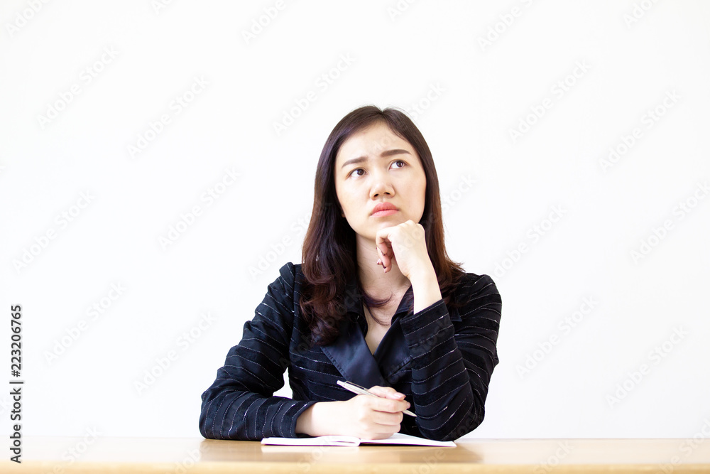 Asian business women age between 25-30 years old in the black suit in action close up on white background. Concept of thinkful and idea generation. Asian business women age between 25-30 years old in the black suit in action close up on white background. Concept of thinkful and idea generation.
