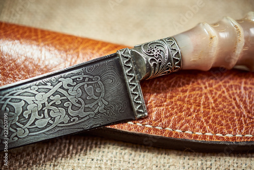 Beautiful knife from damask steel with patterns on the blade