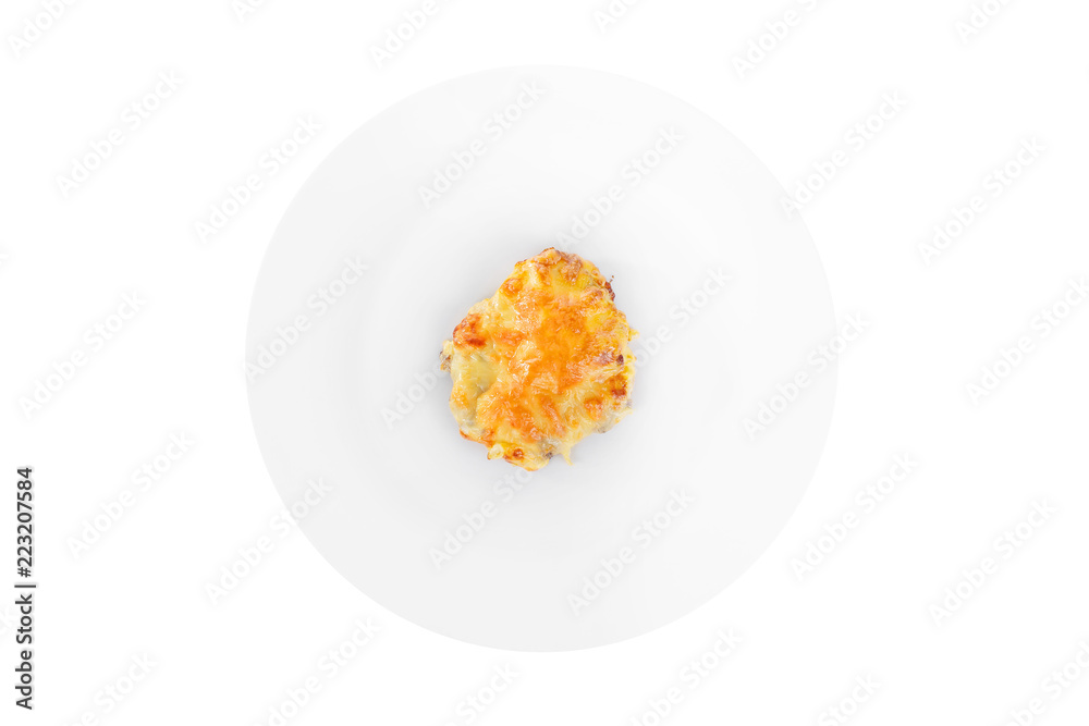 Meat, pork, beef, chicken, fish baked under a crust of mayonnaise and cheese on a plate, isolated on white background, view from above. Serving for a cafe, a restaurant in the menu