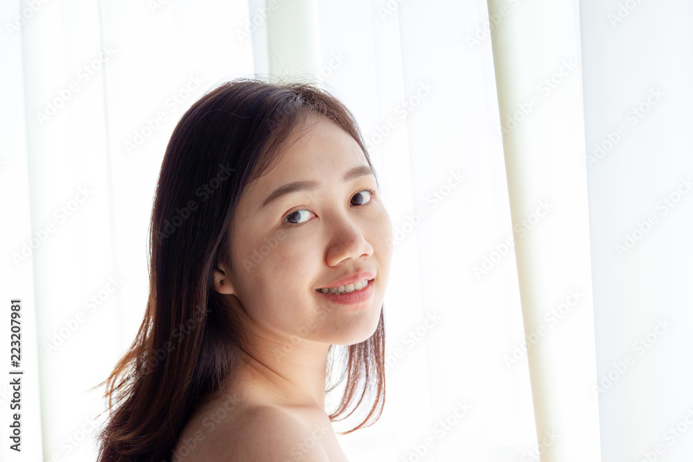 Portrait of beautiful Asian women in morning with natural lighting from window close up. Portrait of beautiful Asian women in morning with natural lighting from window close up.