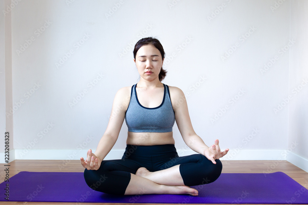 Asian women doing Yoga exercise.  Concept of healthy women in modern life.