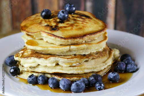 Stack of Blueberry Pancakes with Maple Syrup and Fresh Blueberries