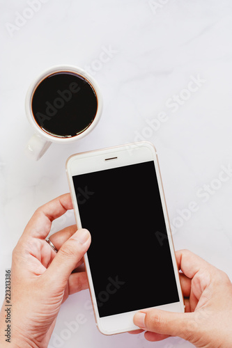 Hand holding smartphone wit...