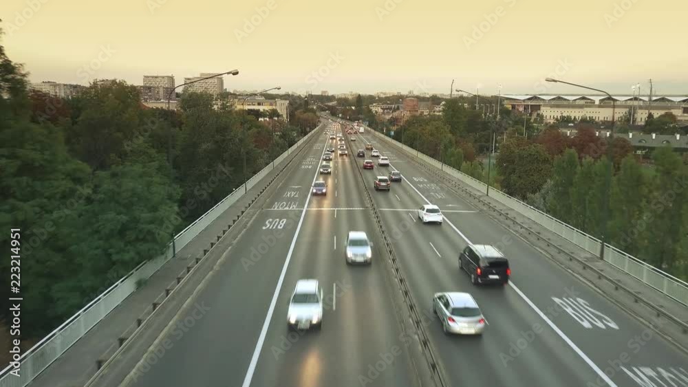 Aerial view of city road traffic on the bridge in the evening. Warsaw, Poland Aerial view of city road traffic on the bridge in the evening. Warsaw, Poland