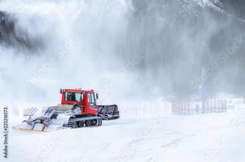 Snow groomer going into a snow blizzard