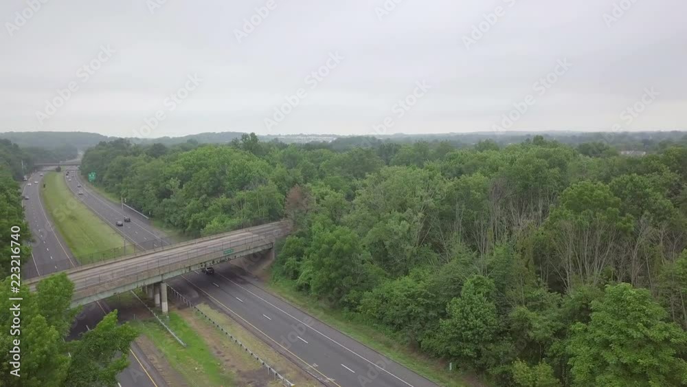 Drone over interstate highway cars and overpass Drone over interstate highway cars and overpass