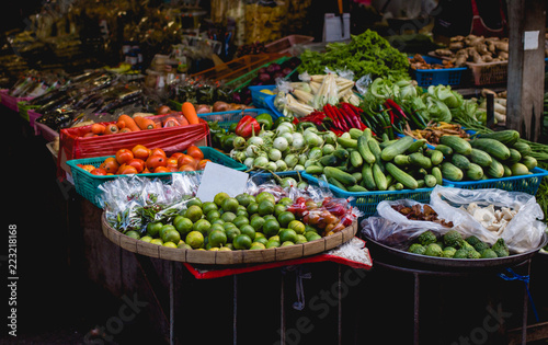 exotic fruits and vegetables on the shelves of market, Asia