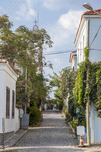 Picturesque and floral church street of Tenedos (Bozcaada) Island by Aegean Sea