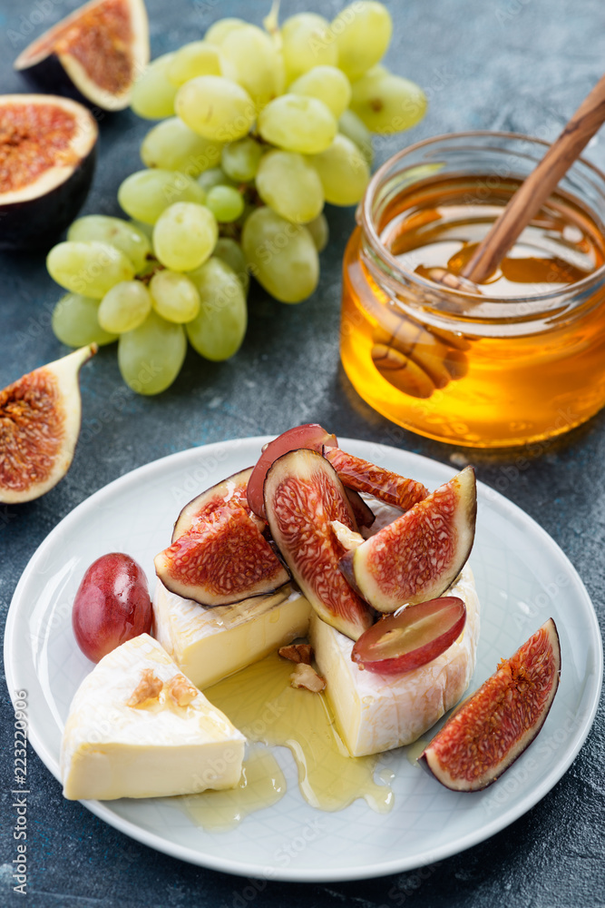 Cheese brie with figs,grape and honey. Cheese brie with figs,grape and honey.