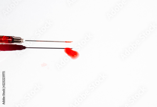 print of blood drop streaks on white background for medicine design