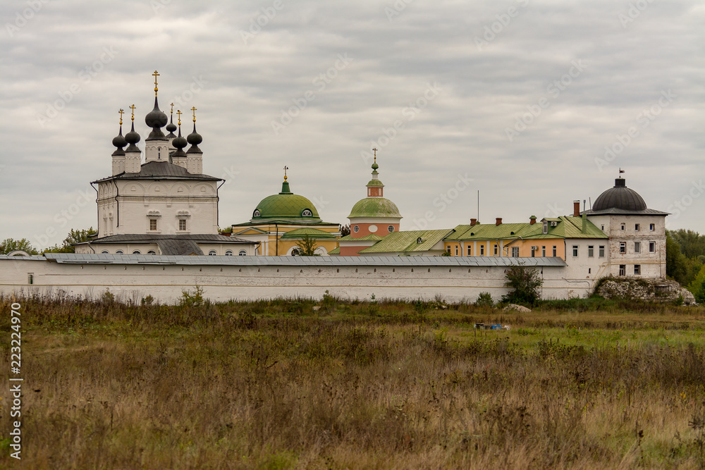Fototapeta premium Holy Trinity Belopesotsky Convent in the cloudy autumn afternoon in a distance