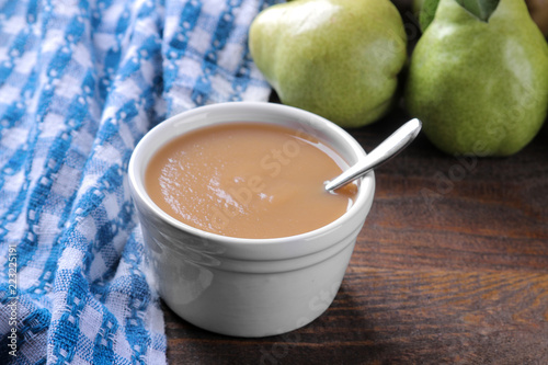 Wallpaper Mural Pear puree in a white bowl next to fresh ripe pears on a wooden brown table Torontodigital.ca