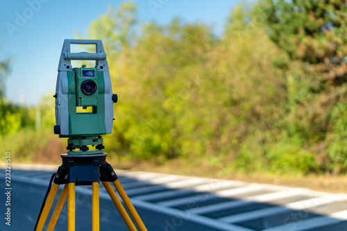 Photography Surveyor equipment (theodolit or total positioning station) on the construction