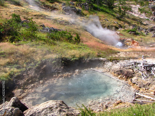 Geothermal activity  hot thermal springs with boiling water and fumes at Yellowstone National Park  USA