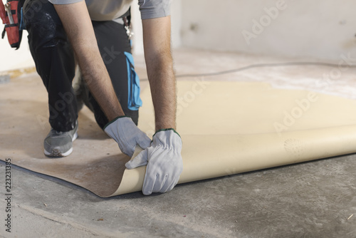 Contractor removing an old linoleum flooring