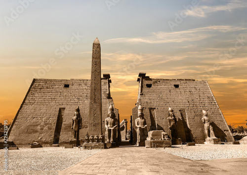 Entrance to Luxor Temple at sunset, a large Ancient Egyptian temple complex located on the east bank of the Nile River in the city today known as Luxor (Thebes). Was consecrated to the god Amon-Ra