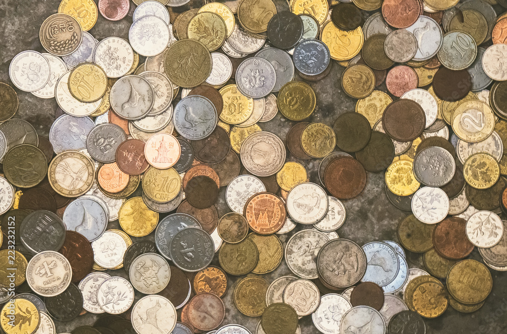 Obraz na plátně Lots of different coins. Close-up view.