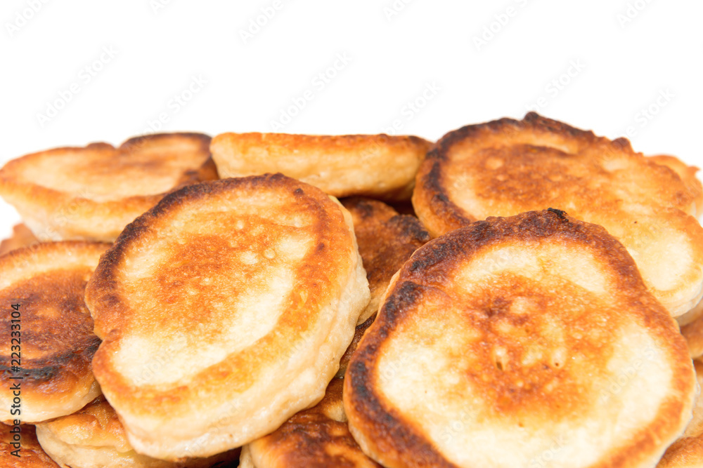 Heap of sweet toasted pancakes isolated on white background