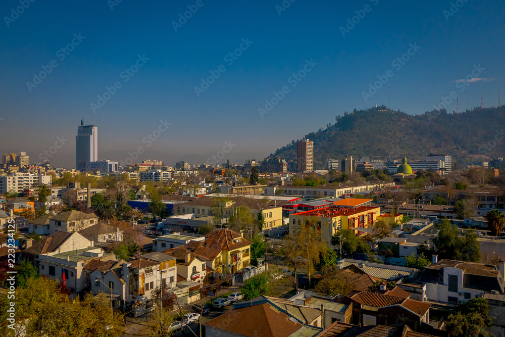 SANTIAGO, CHILE - SEPTEMBER 13, 2018: Outdoor view of Skyline of Santiago de Chile at the foots of The Andes Mountain Range and buildings at Providencia district