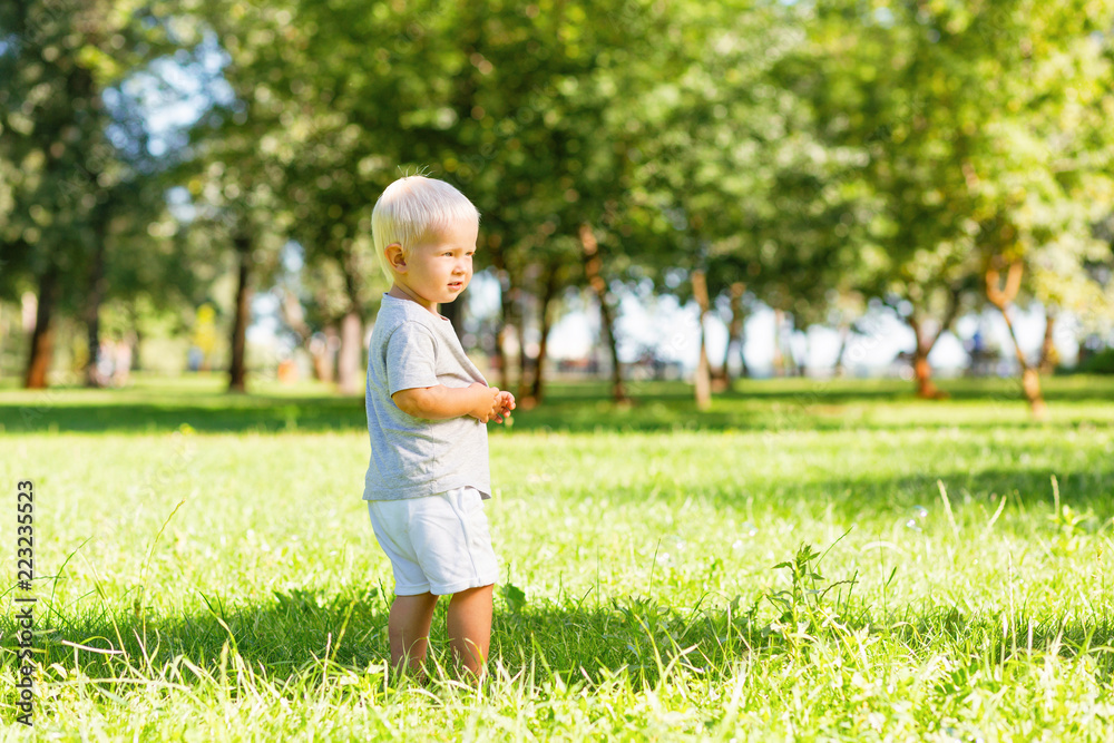 Happy moments. Nice little kid feeling alright while spending a day in the garden Happy moments. Nice little kid feeling alright while spending a day in the garden