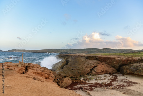 Waves break on the rocks