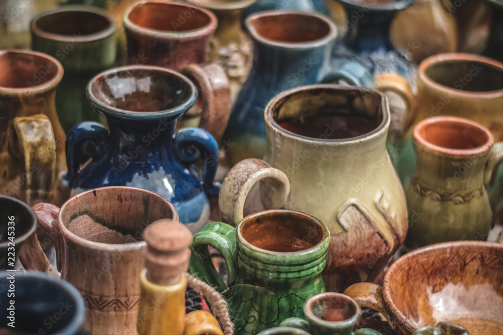colorful clay vases and pots on marketplace in riga with specific focus
