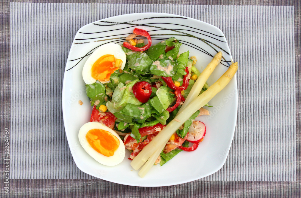 Breakfast salad with fresh leaves, vegetables and beans