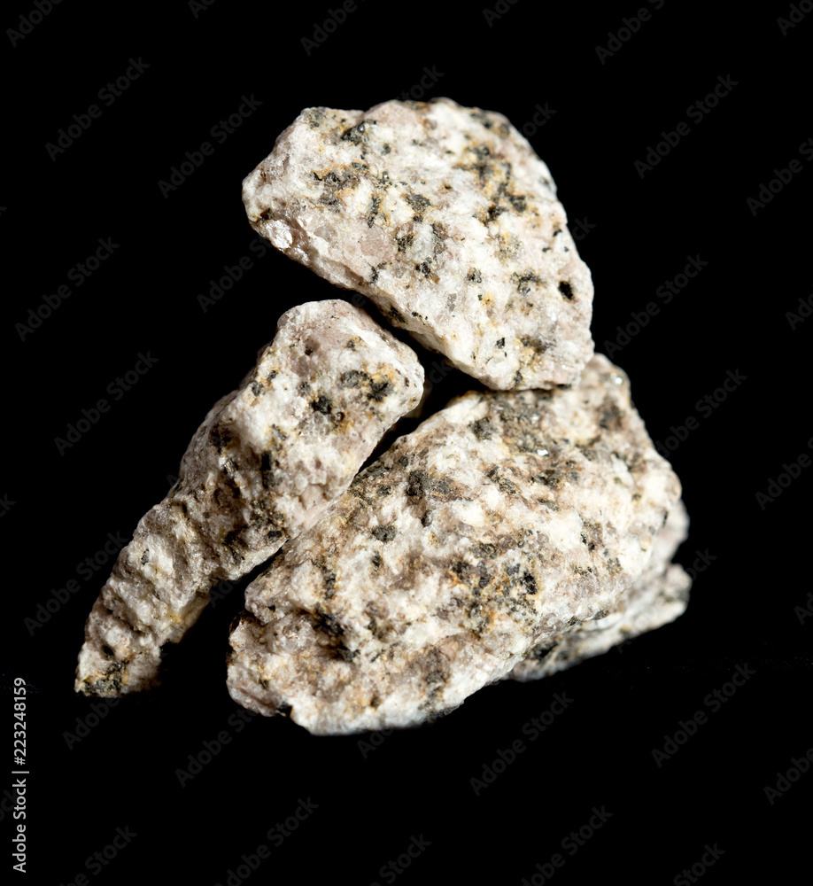 Granite fragment on a black background Granite fragment on a black background